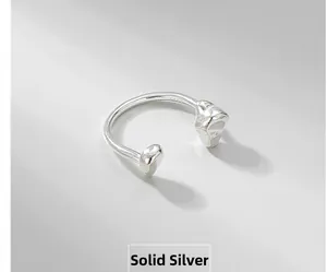 Macro shot of minimalist S925 sterling silver ring showing the engraved S925 hallmark