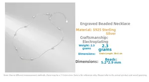 Detail view of engraved bead necklace made of S925 sterling silver with polished finish