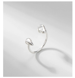 Macro detail of S925 sterling silver adjustable ring with polished organic drop ends