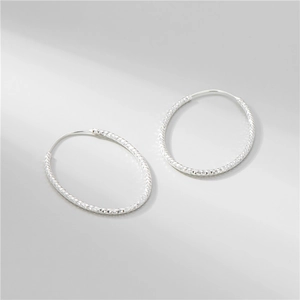 Polished S925 sterling silver hoop earrings with diamond-cut sparkling texture