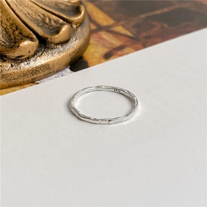 Minimalist S925 sterling silver hammered texture ring shown at a 45-degree angle