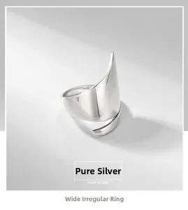 Macro shot of minimalist S925 sterling silver irregular wide open ring with polished finish