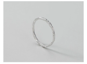 Macro view of S925 sterling silver ring featuring a handcrafted hammered texture