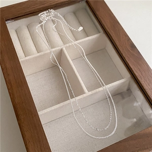 Elegant S925 sterling silver double-layered chain necklace displayed in a premium jewelry box