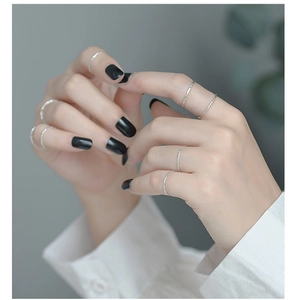 Detail showing minimalist S925 sterling silver hammered texture rings on hand