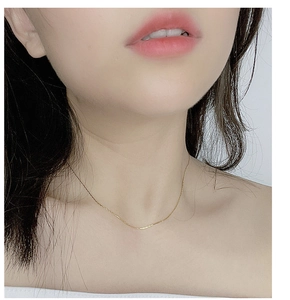 Detailed view of an ultra-fine gold S925 sterling silver minimalist choker necklace