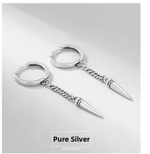 Macro shot of S925 sterling silver hoop earrings with chain and punk cone pendant