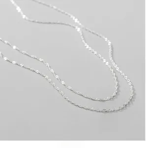 Detailed close-up of S925 sterling silver water wave chain with shimmering texture