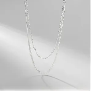 Detail of layered S925 sterling silver Chopin chain with minimalist silky texture