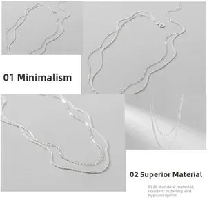 Detail of layered S925 sterling silver chain showing clasp and smooth texture