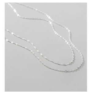 Close-up of S925 sterling silver double-layer water ripple chain with sparkling texture