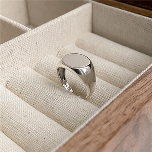 Detail view of S925 sterling silver minimalist oval signet ring in a premium jewelry box