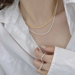 S925 sterling silver rope chain necklaces and minimalist rings on a model with white shirt