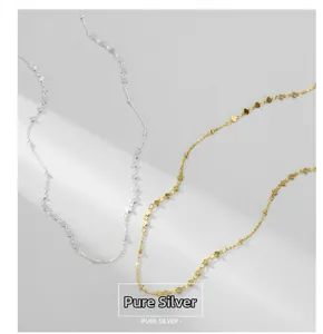 Close-up of S925 sterling silver and gold heart pendant necklaces with subtle shadow detail