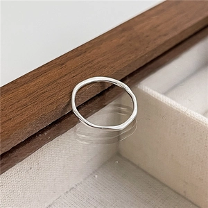 Close-up of S925 sterling silver ring with irregular wavy texture and polished finish