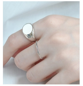 Detail of minimalist S925 silver rings with wide flat and irregular wave textures