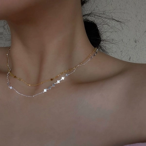 Minimalist S925 sterling silver layered necklace with tiny clover charms on model