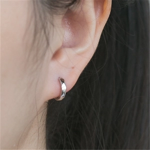 Minimalist S925 silver rhombic faceted hexagonal hoop earrings shown on ear