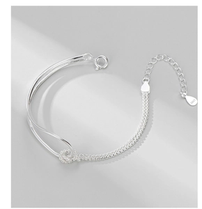 Detail showing S925 sterling silver knot bracelet with rigid bar and extension chain