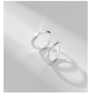 Macro shot of geometric faceted S925 sterling silver hoop earrings with polished finish