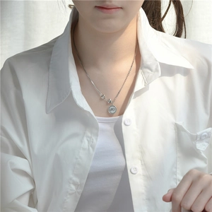 S925 sterling silver elephant coin and heart pendant necklace worn on white shirt