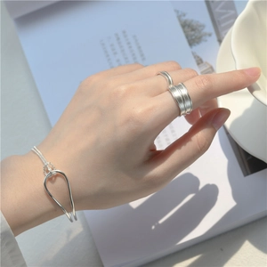 Minimalist S925 sterling silver knot bracelet and rings set with a sleek geometric design