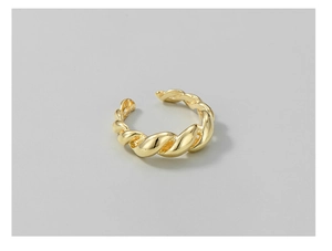 Macro detail of high-polish twisted rope texture on a golden S925 sterling silver ring