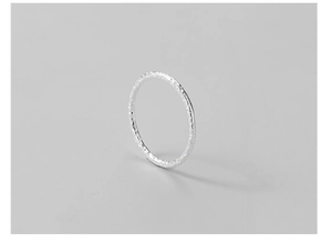 Detail of 925 sterling silver ring with unique hammered tin foil texture and matte finish