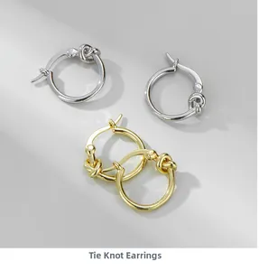 Close-up of S925 sterling silver knotted hoop earrings in gold and silver finishes