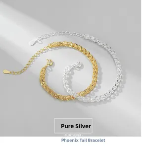 Close-up of S925 pure silver phoenix tail bracelet with gold and silver woven texture