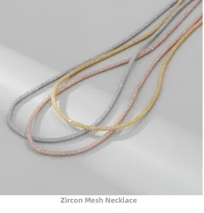 Detailed macro shot of shimmering gold silver and rose gold diamond mesh tube necklaces