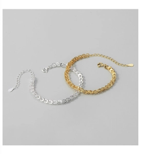 Detail of S925 sterling silver phoenix tail bracelets in gold and silver with S925 hallmark