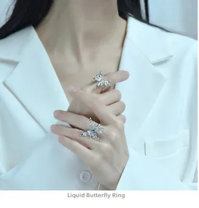 Detailed close-up of S925 sterling silver liquid butterfly ring on a model's hand