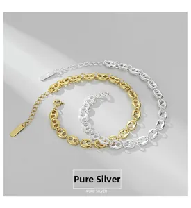Detail of silver and gold pig nose chain bracelets with S925 hallmark and clasp