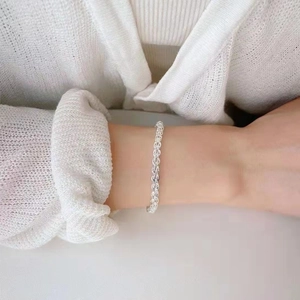 Elegant S925 sterling silver phoenix tail woven chain bracelet worn on a female wrist