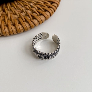 Macro shot of 925 sterling silver vintage heart ring showing black drip oil details