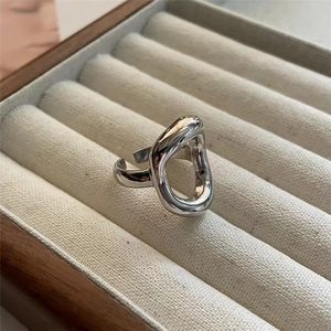Artistic S925 sterling silver hollow ring with irregular lava design in a jewelry box