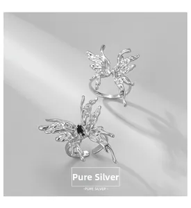 Detailed shot of liquid-style S925 sterling silver butterfly rings with black gemstone