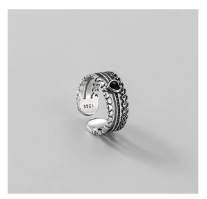 Detailed view of vintage S925 silver ring with black heart gemstone and hollow texture
