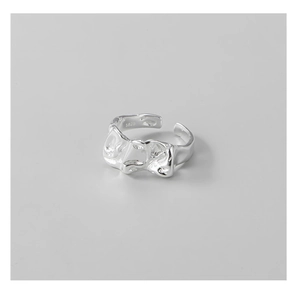 Close-up of S925 sterling silver ring featuring artistic irregular folded metal texture