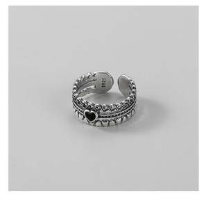 Macro detail of 925 sterling silver heart ring showing the S925 hallmark and black patina