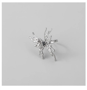 Macro shot of liquid metal butterfly ring with black zircon stone inlay detail