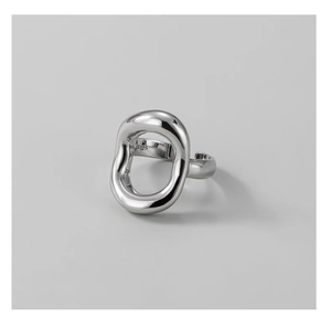 Detailed close-up of S925 sterling silver stamp on a minimalist open oval ring band