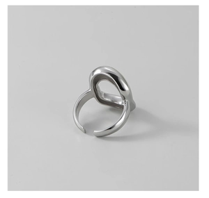 Macro shot of silver S925 open ring featuring an abstract hollow organic design