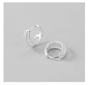 Detailed close-up of S925 sterling silver hoop earrings with triple-layer twisted texture