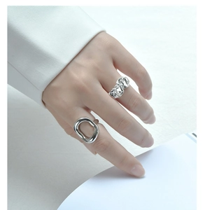 Detail of silver S925 sterling silver liquid metal and wrinkled texture rings for women