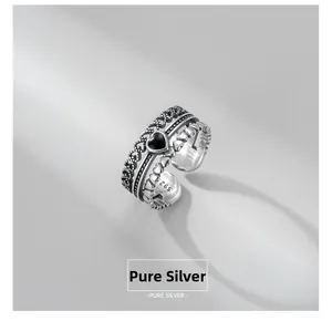 Macro view of S925 sterling silver vintage layered ring with black heart gemstone