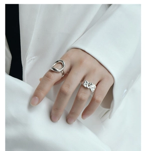 Macro detail of S925 sterling silver rings showing irregular hollow and wrinkled textures