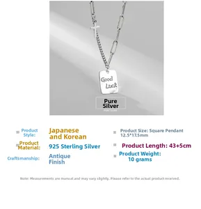 Detailed close-up of S925 sterling silver Luck square pendant and cross on a chain