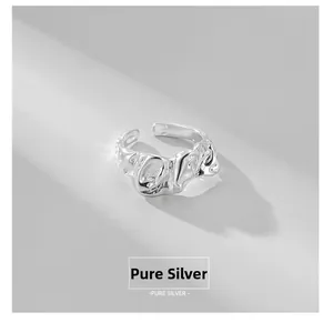 Detailed macro view of S925 sterling silver ring with irregular hammered texture